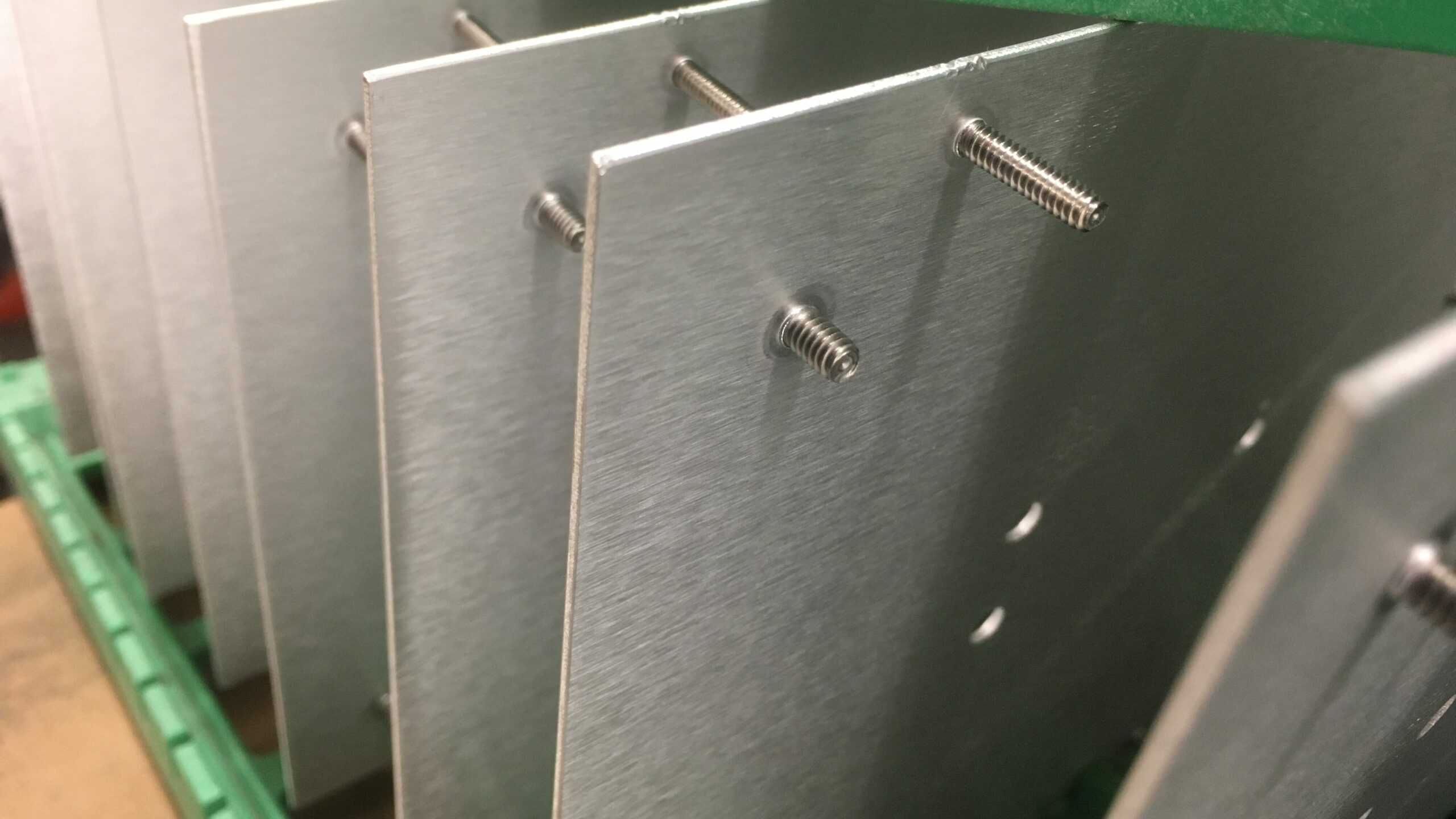 Stud hardware inserted in front panel